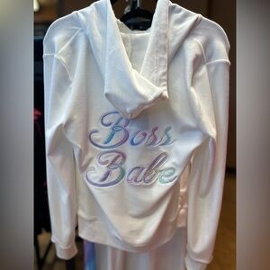 Paris Hilton track suits “Boss Babe”. And “That’s Hot”.
